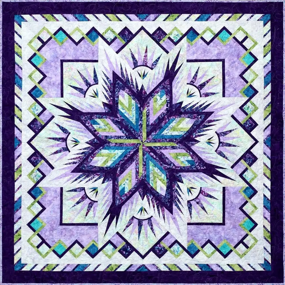 Paper pieced star quilt in purple, lavender and green, made by Karen Jarrett