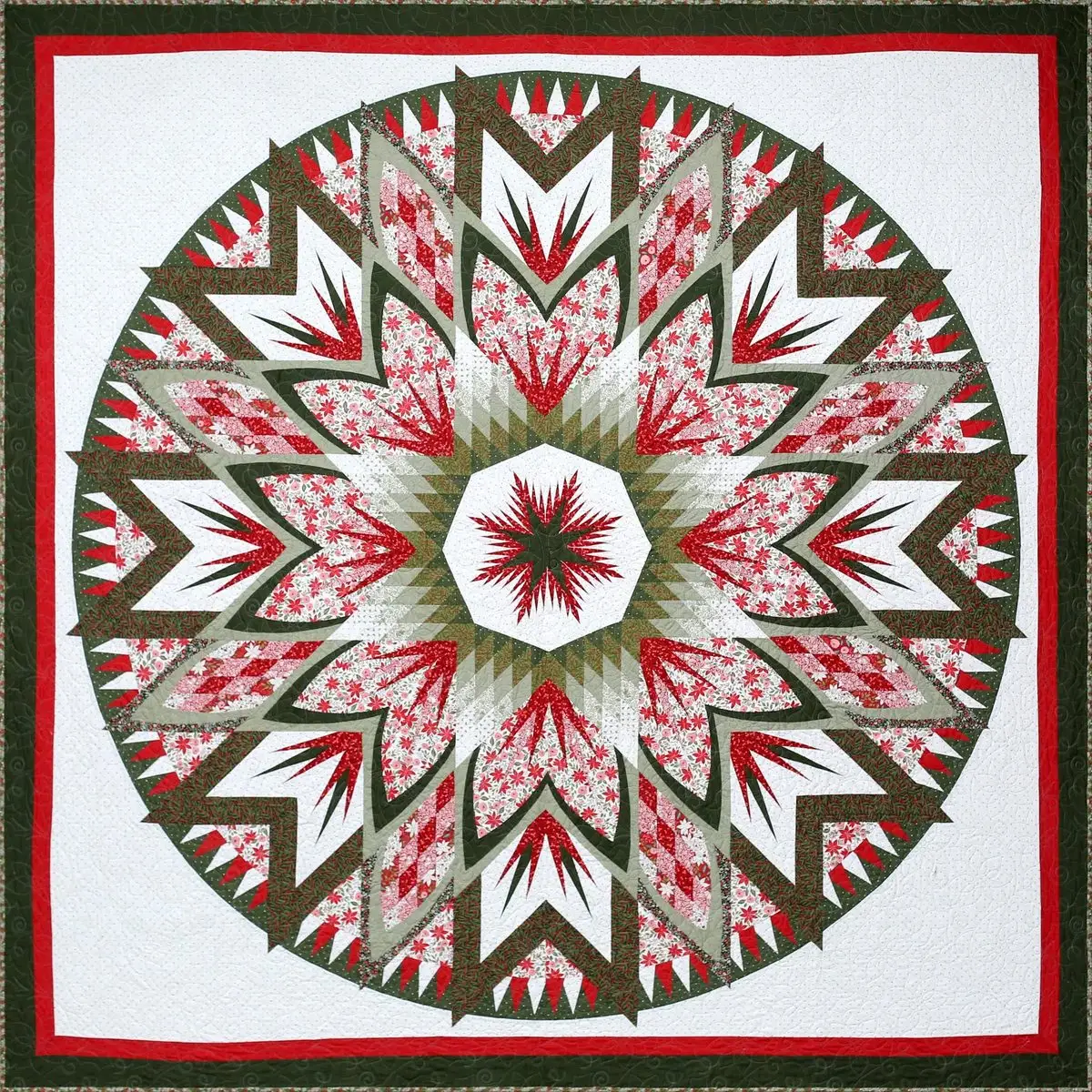 Round feathered star quilt in red, green and white, made by Karen Jarrett